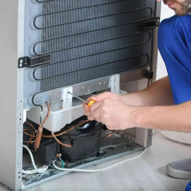 Appliance Repair near me in abilene TX 1 Technician repairing refrigerator at home – refrigerator repair near me in Abilene TX